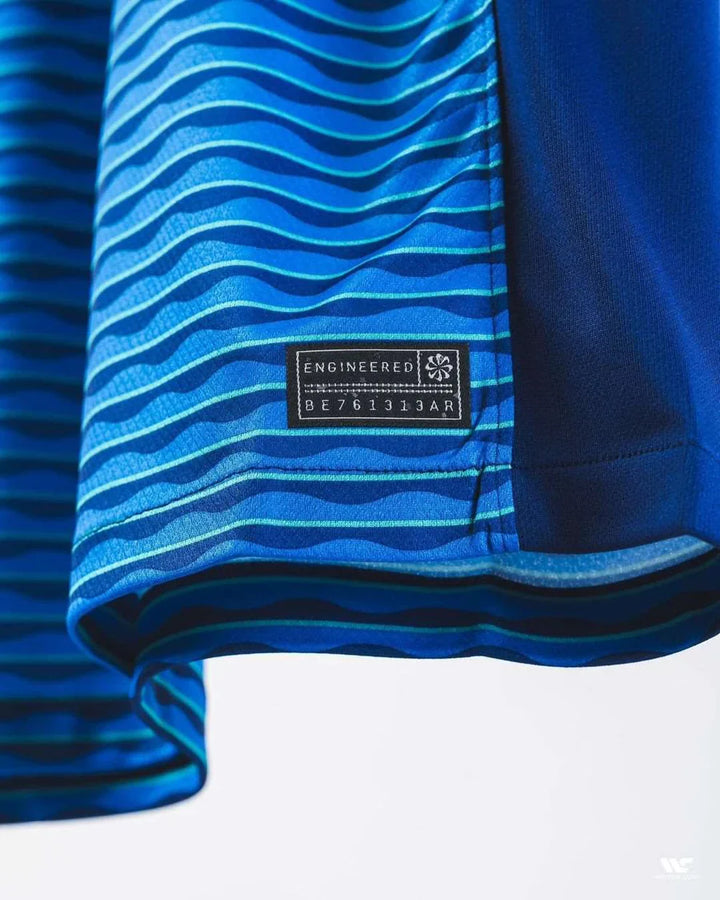 Brazil 2024-25 away jersey featuring a blue wave design and engineered label detail