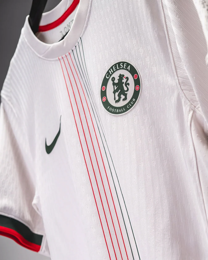 Chelsea away jersey 2025-26 by Striker Store white with red and black stripes and club logo