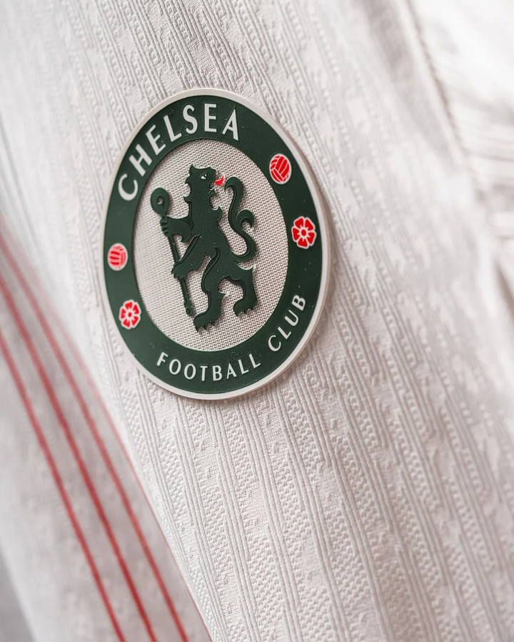 Close-up of Chelsea away jersey 2025-26 with club crest and textured fabric from Striker Store