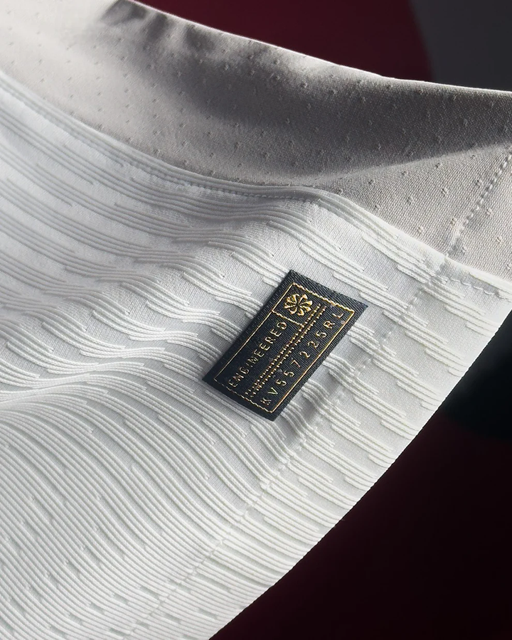 Striker Store close up of Tottenham Hotspur 2025 home jersey white fabric texture and woven label