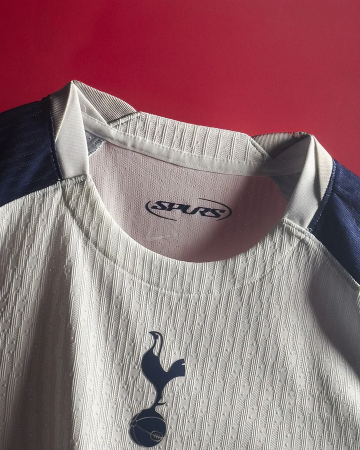 Striker Store close up of Tottenham Hotspur 2025 home jersey white textured fabric and crest