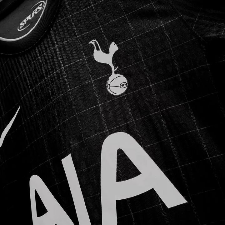 Striker Store black Tottenham Hotspur away jersey 2025-26 close up showing crest AIA sponsor and Nike swoosh
