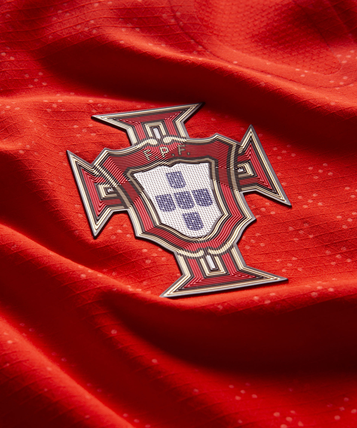 Close-up of Portugal Home Jersey 2024 with detailed national badge on red fabric