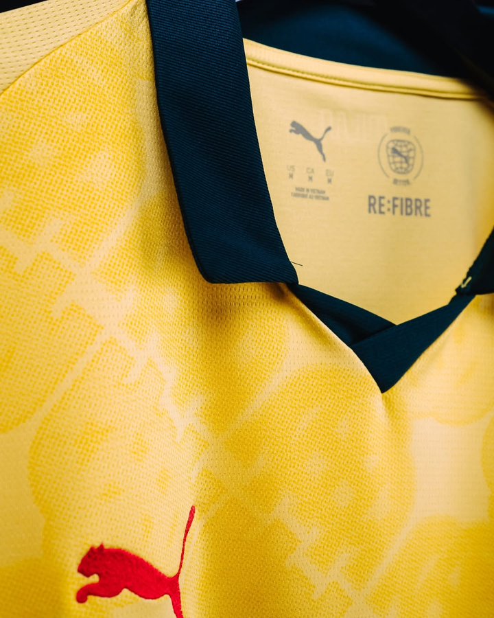 AC Milan 2025-26 third jersey pre order yellow Puma jersey with black collar red Puma logo close up