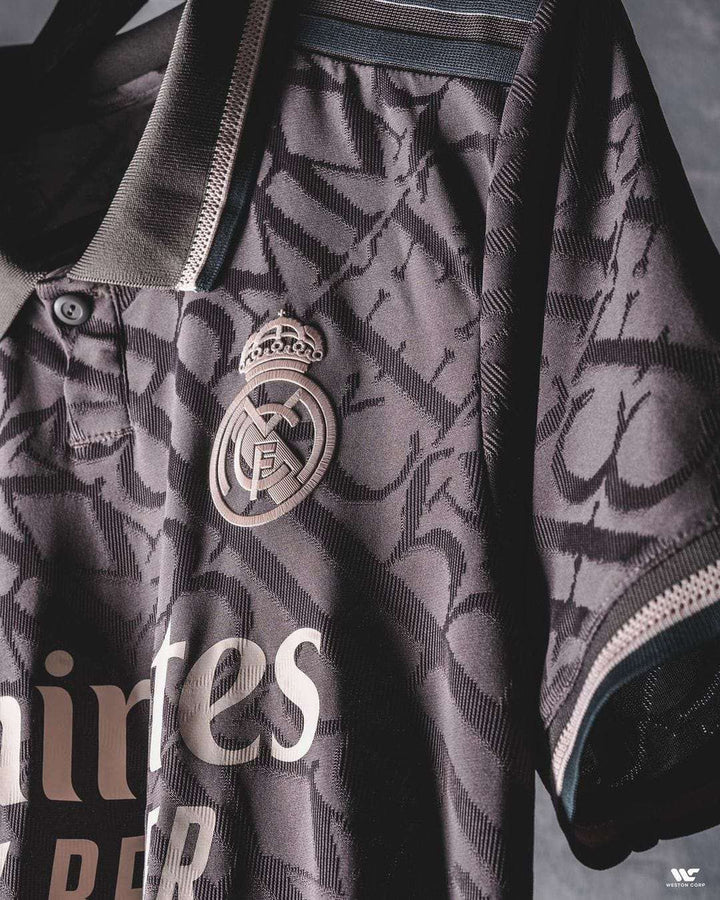 Real Madrid 2024-25 player jersey featuring embroidered logo and stylish design details
