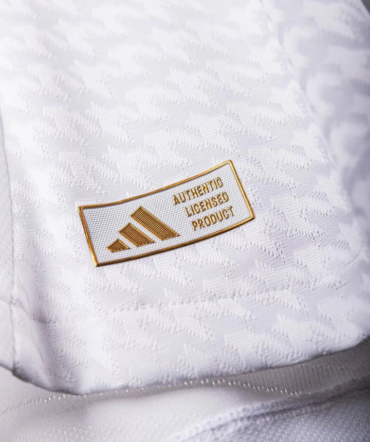 Real Madrid jersey fan version with authentic licensed product tag by Striker Store