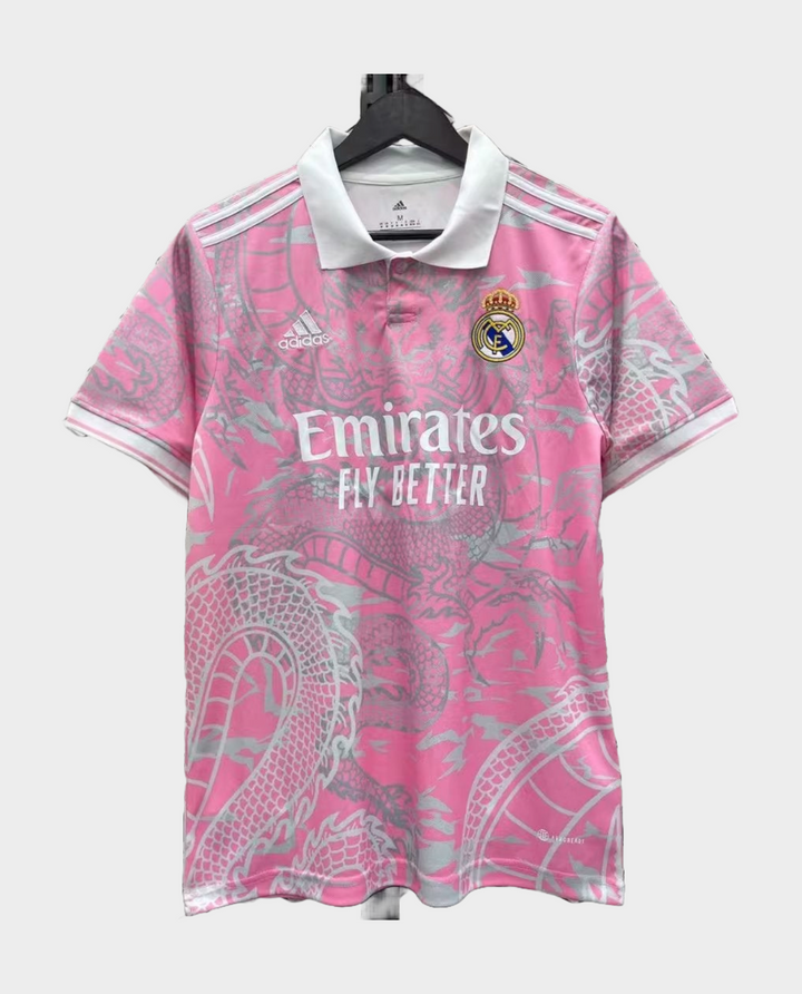 Real Madrid pink dragon jersey featuring a unique dragon design and embroidered team logo