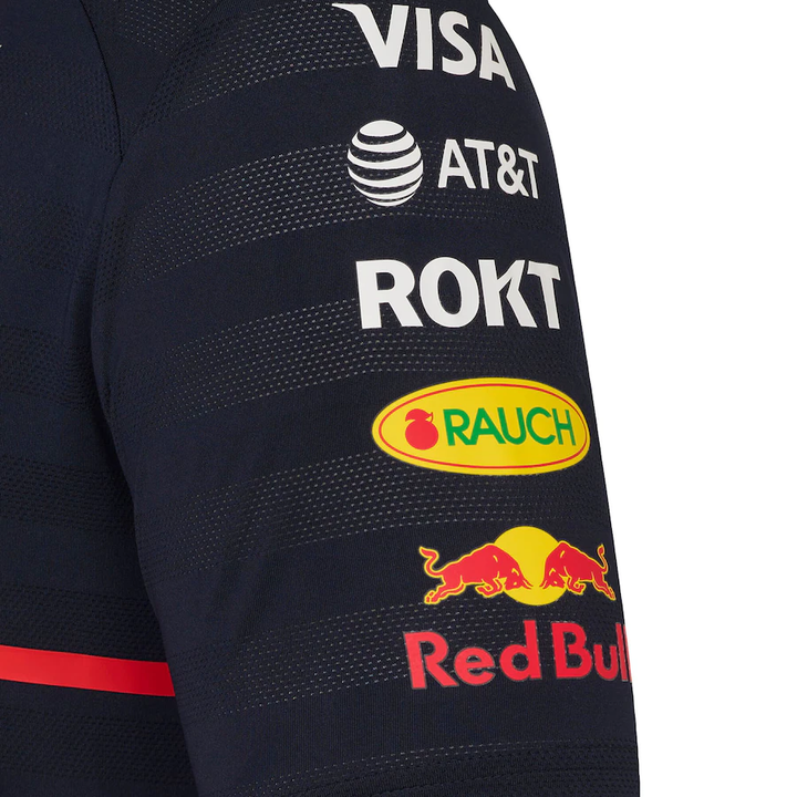 Red Bull Racing Team Polo 2025 featuring sponsor logos and a stylish navy design for fans