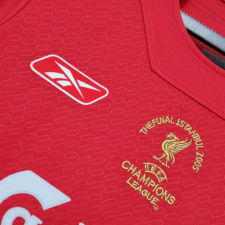 Retro Liverpool 2005 jersey featuring gold detailing and iconic Champions League emblem