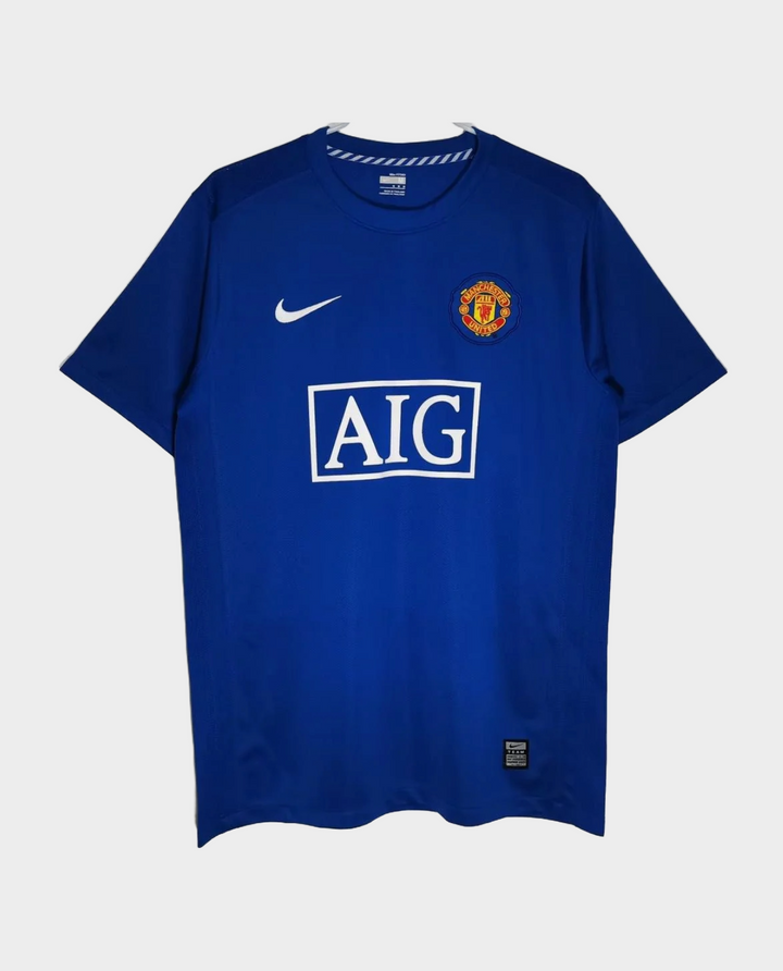 Retro Manchester United jersey 2008-09 in blue by Striker Store with classic logo and Nike branding