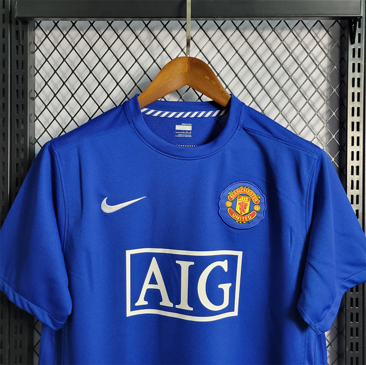 Retro Manchester United jersey 2008-09 in blue with AIG logo and Nike swoosh