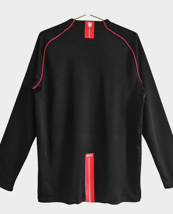 Back view of the Retro Manchester United jersey 2008 in black with red accents and team branding