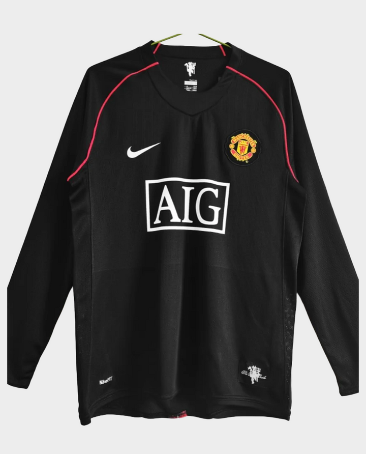 Retro Manchester United jersey 2008 in black with red accents and AIG logo for fans and collectors