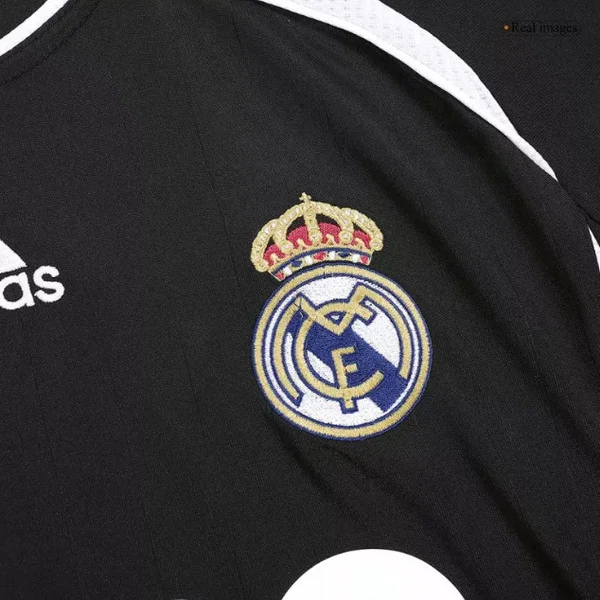 Retro Real Madrid 2006-07 jersey featuring iconic club badge in black and white design