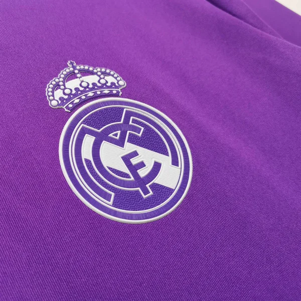 Detail of the Retro Real Madrid jersey 2016-17 featuring the iconic club logo in purple